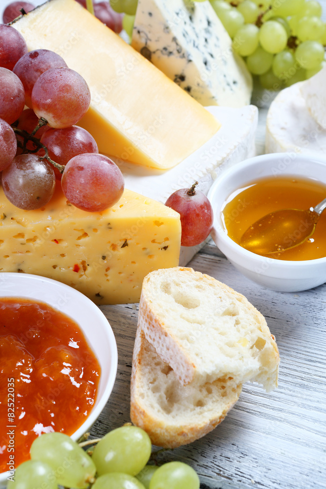 Tasty cheese on a board with jam Tasty cheese on a board with jam