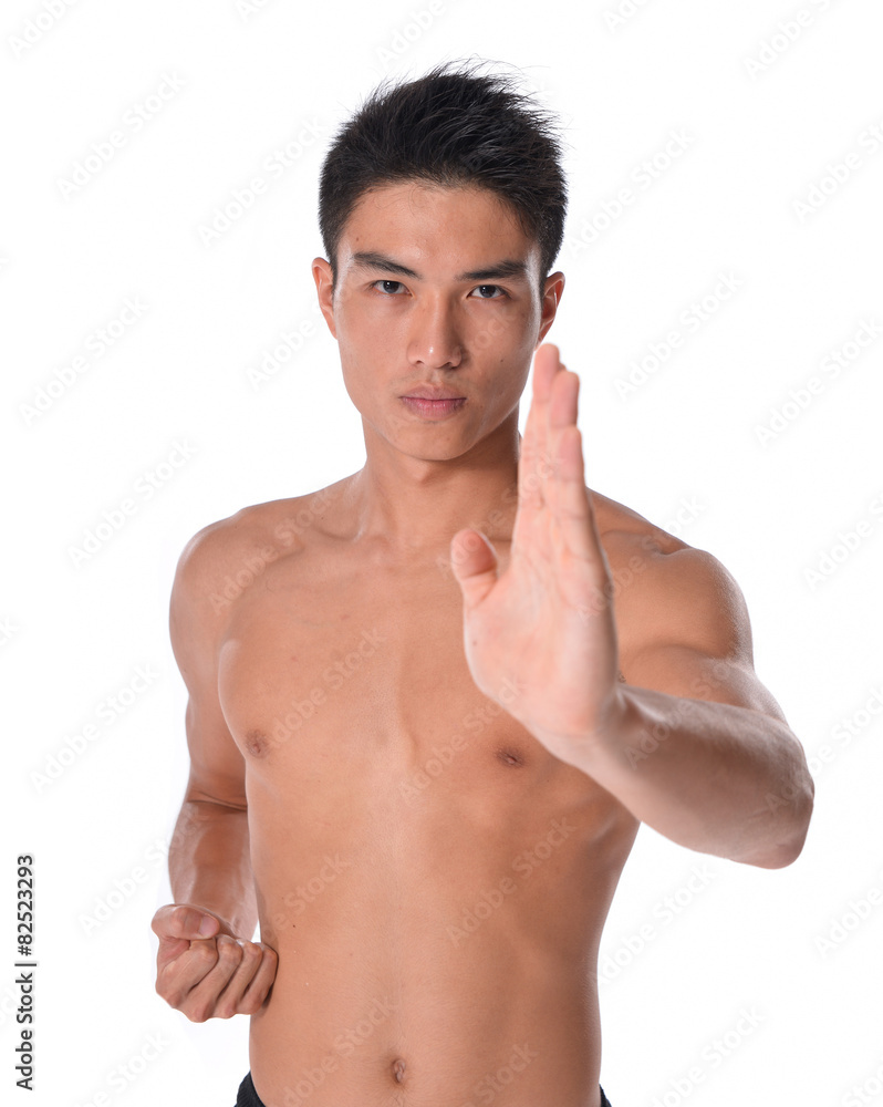 Young sportsman, fitness muscle model guy making bodybuilding exercise isolated on white. Concept of sport, health Young sportsman, fitness muscle model guy making bodybuilding exercise isolated on white. Concept of sport, health