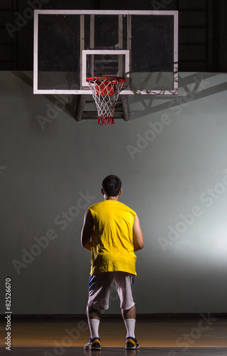 Basketball player prepare for shooting ball to basket
