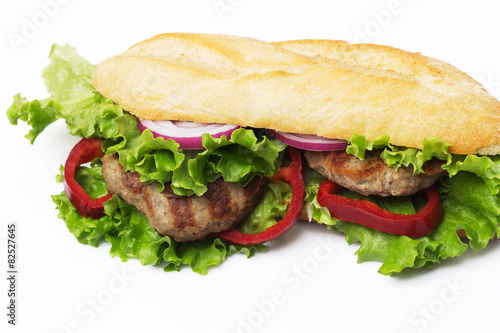 Sandwich with beef cutlet, lettuce, onions 