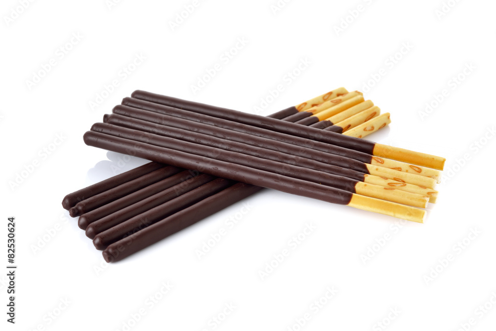 crackers stick and coated with back chocolate on white backgroun crackers stick and coated with back chocolate on white backgroun