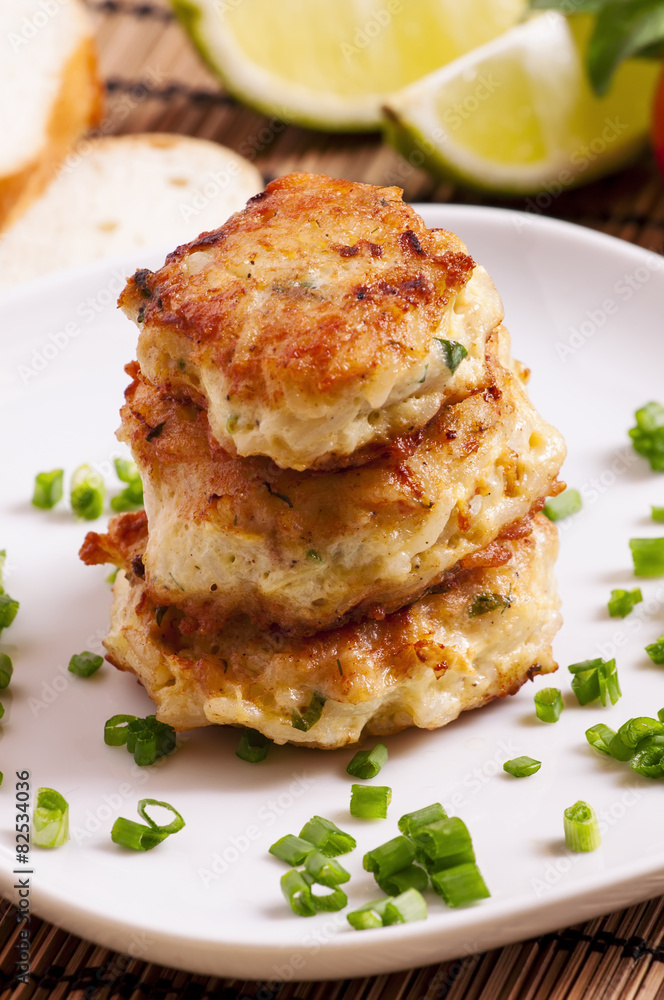 Homemade chicken cutlets sprinkled with green onion, selective f Homemade chicken cutlets sprinkled with green onion, selective f