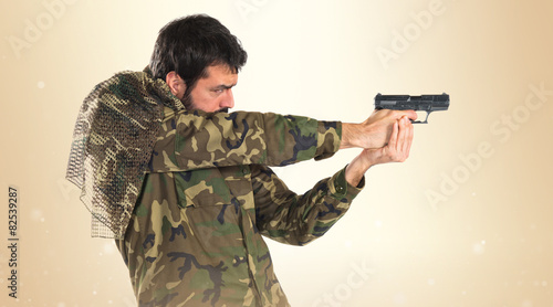 Soldier shooting a gun