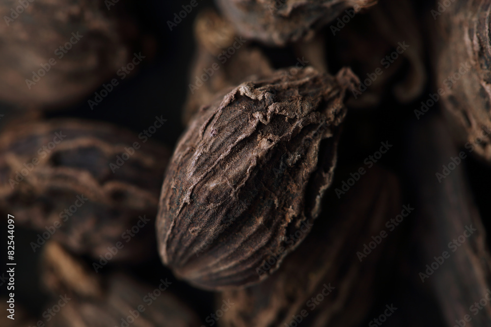 Seeds of black cardamom. Macro. Blurred background Seeds of black cardamom. Macro. Blurred background