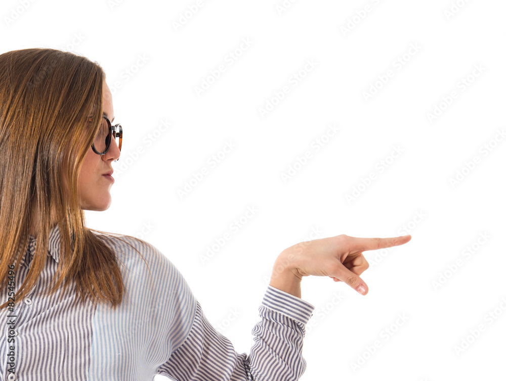 Teen girl pointing to the lateral Teen girl pointing to the lateral