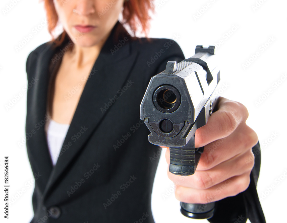 Redhead girl shooting with a pistol Redhead girl shooting with a pistol