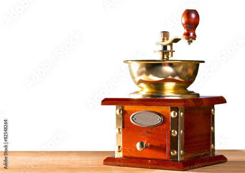 Coffee grinder on the table with isolated background