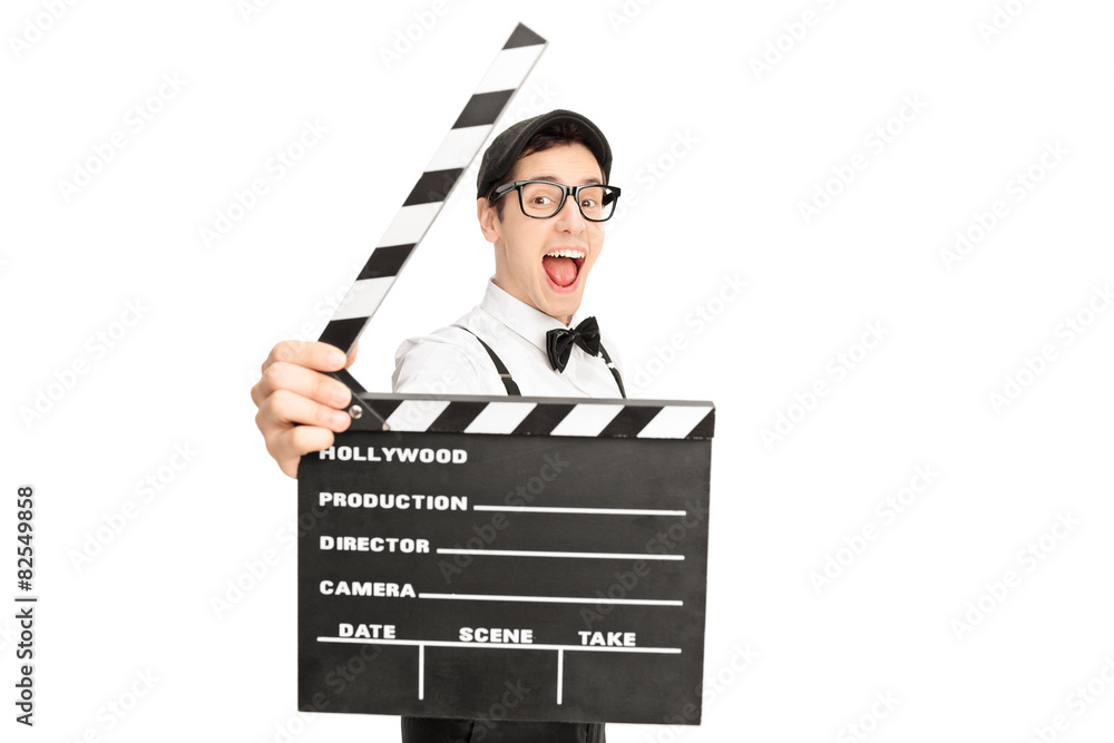 Excited movie director posing behind a clapperboard Excited movie director posing behind a clapperboard