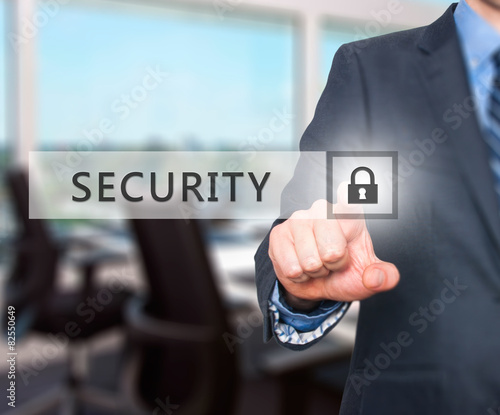 Businessman pressing security button on virtual screens.