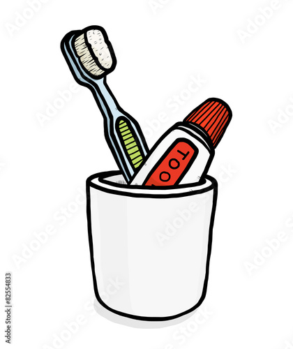toothbrush and toothpaste in glass