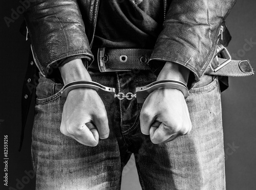 Canvas Print man hands in handcuffs