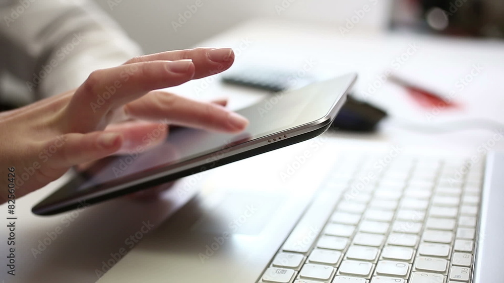 Business concept - executive working on digital tablet in office Business concept - executive working on digital tablet in office
