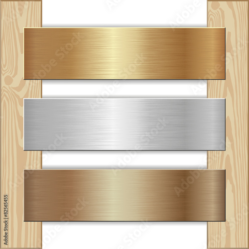 golden, silver and bronze plaques nailed to wooden planks