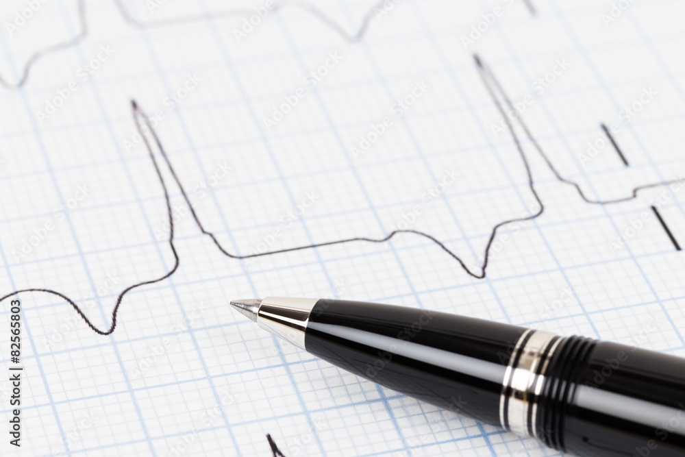 Pen on cardiogram concept for heart diagnostic Pen on cardiogram concept for heart diagnostic