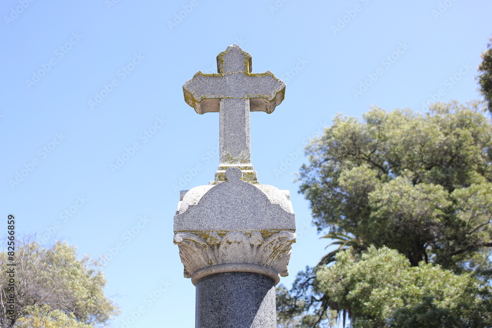 Cross on top of tombstone Cross on top of tombstone
