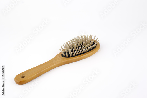 Wooden hair brush isolated on white background