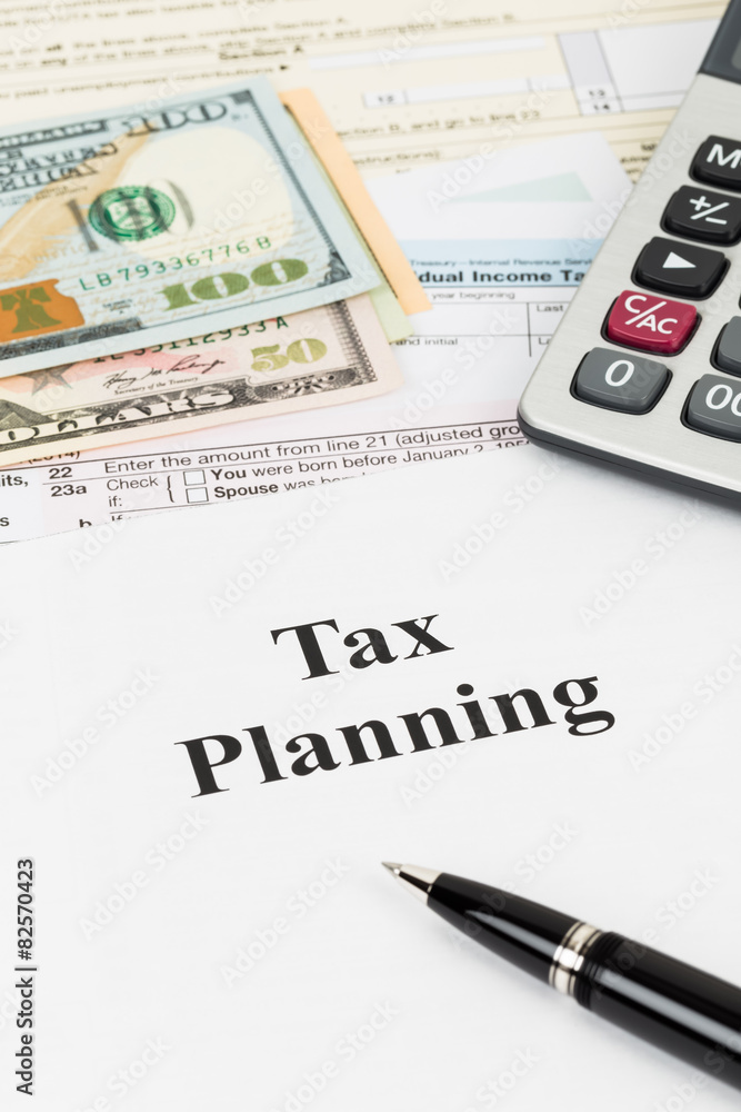 Tax planning wirh calculator and dollar banknote taxation concep