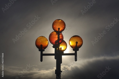 Yellow glass lanterns. city lights. counterlight photo