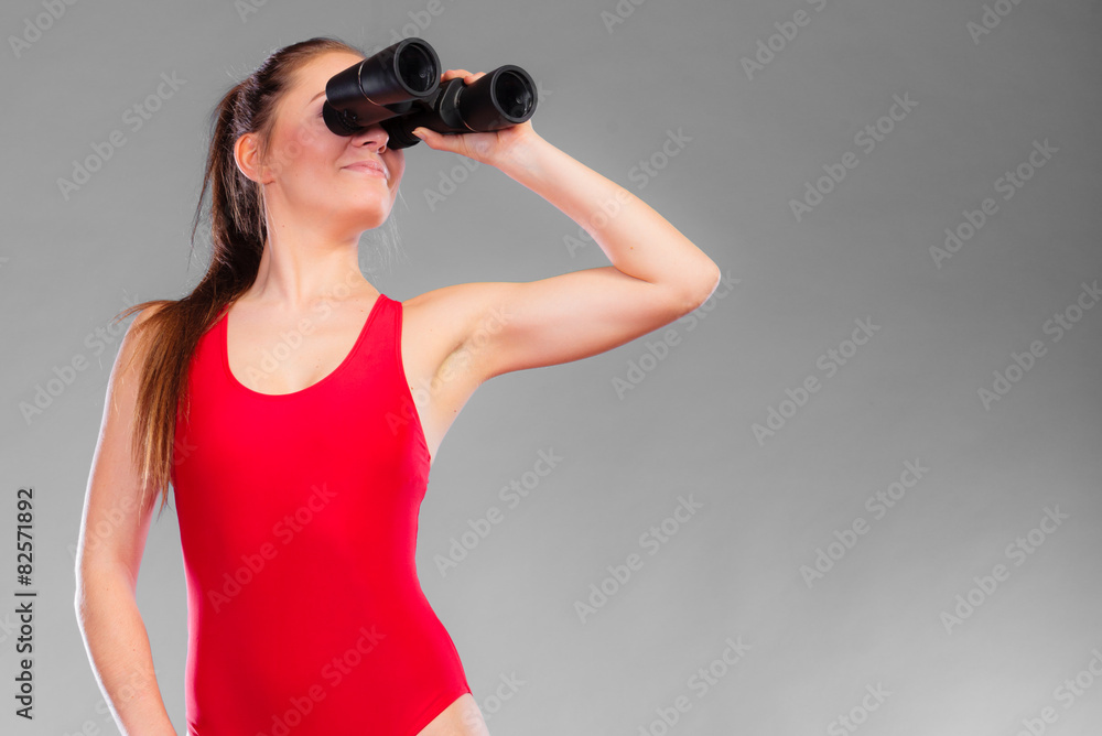 lifeguard on duty looking through binocular lifeguard on duty looking through binocular