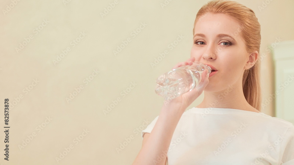 Young woman drinking water Concept of healthy lifestyle Young woman drinking water Concept of healthy lifestyle