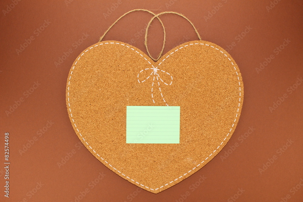 One sticky note on an isolated heartshaped cork board Stock Photo Adobe Stock