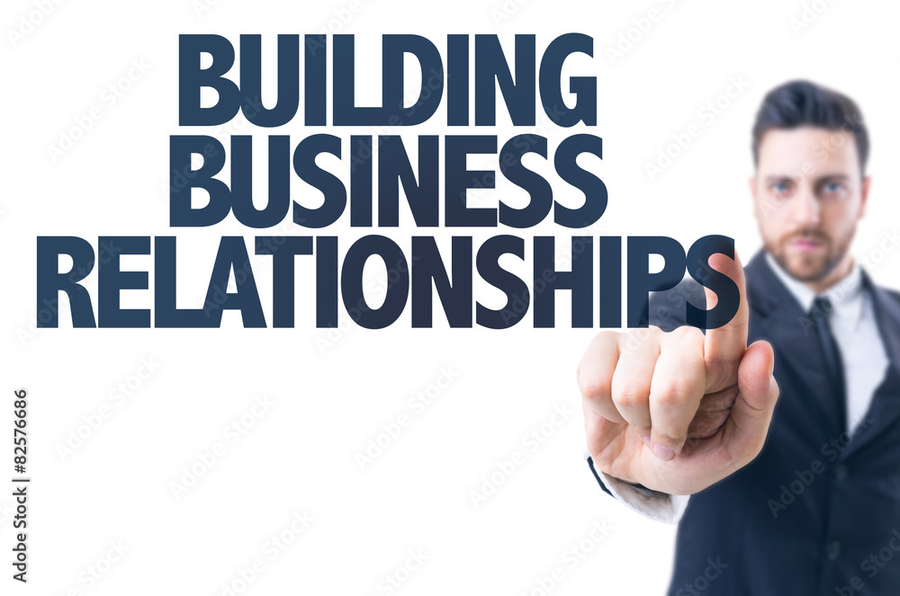 Business man pointing the text: Building Business Relationships Business man pointing the text: Building Business Relationships