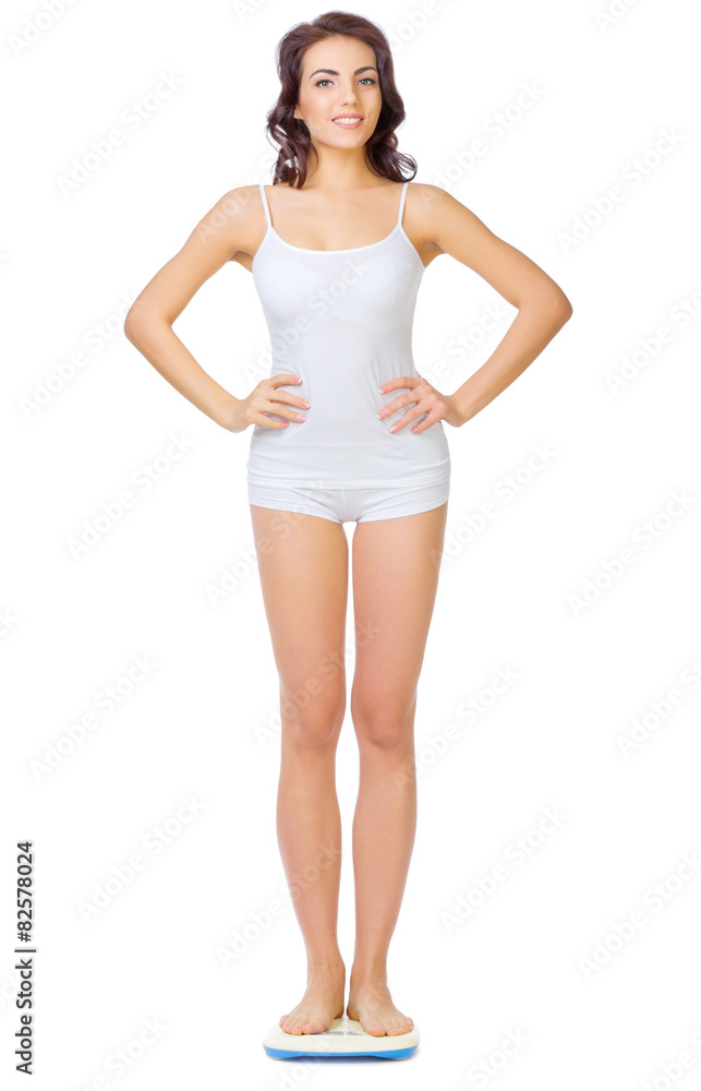 Young healthy girl on home scales Young healthy girl on home scales