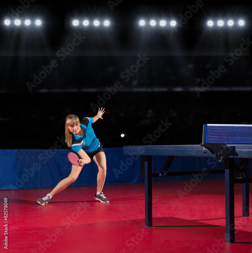 Girl table tennis player at sports hall