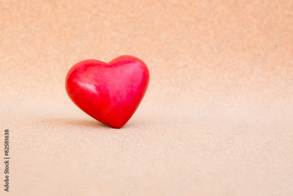 Fototapeta premium red heart on warm wooden background