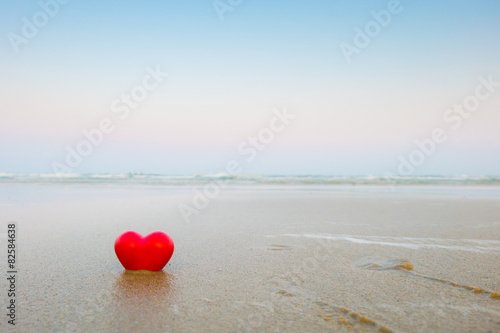 Red hearts on the beach