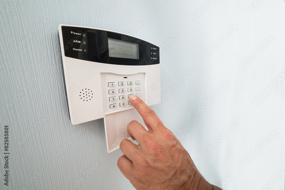 Person's Hand Entering Code Person's Hand Entering Code