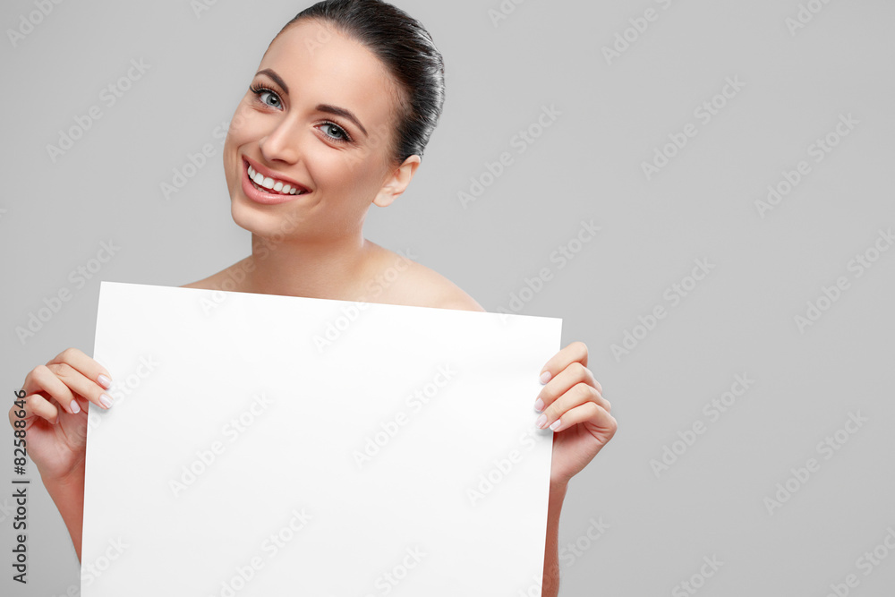 Happy woman showing blank signboard Happy woman showing blank signboard