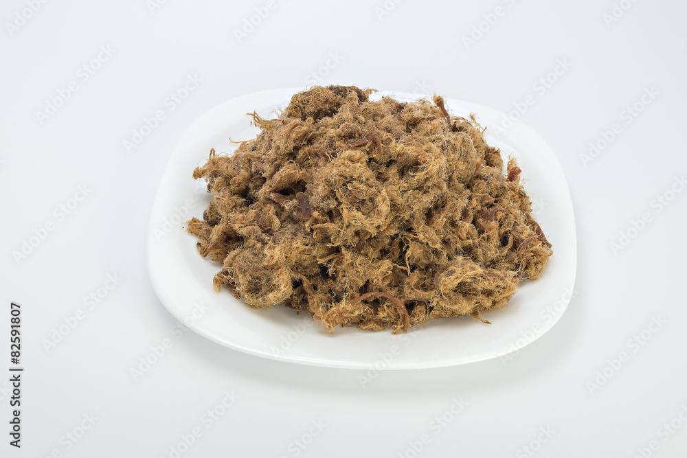 Duvan cvarci, pork greaves on plate isolated on white Duvan cvarci, pork greaves on plate isolated on white
