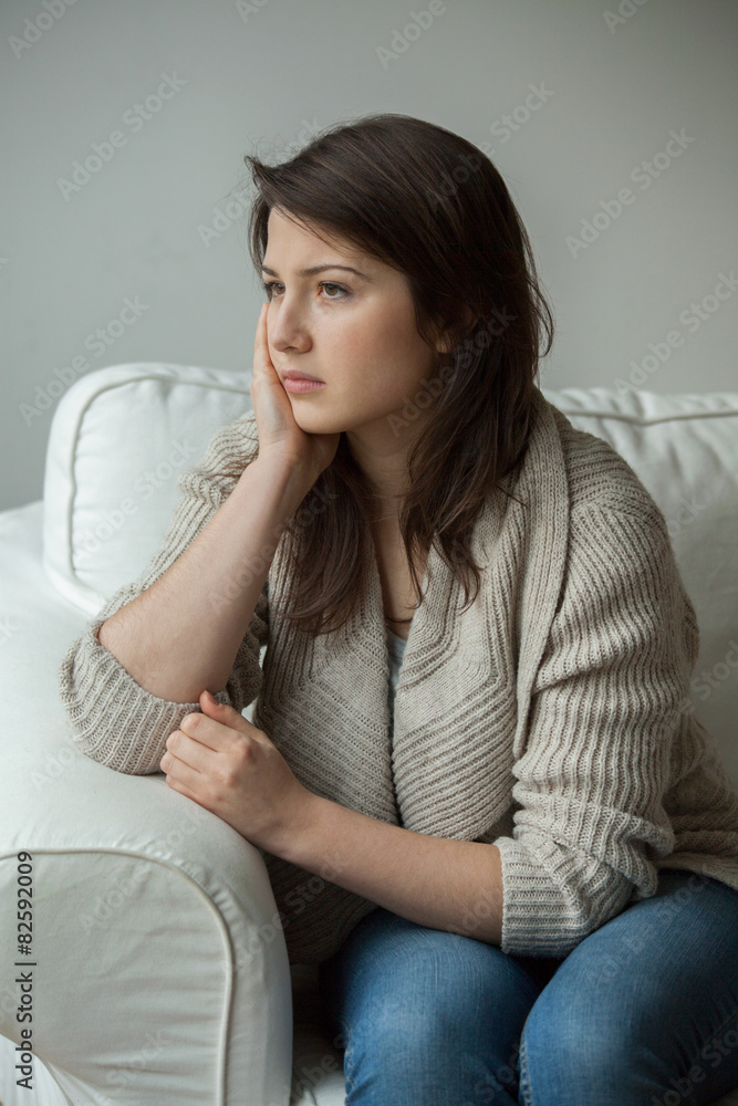 Worried girl sitting alone