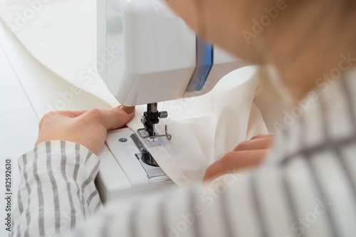 Photos Close-up On Woman Stitching Fabric