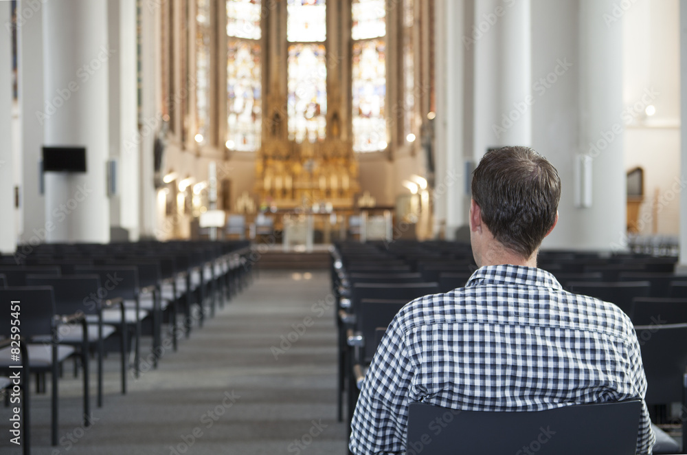 Man Sitting On Chair In Front Of Altar