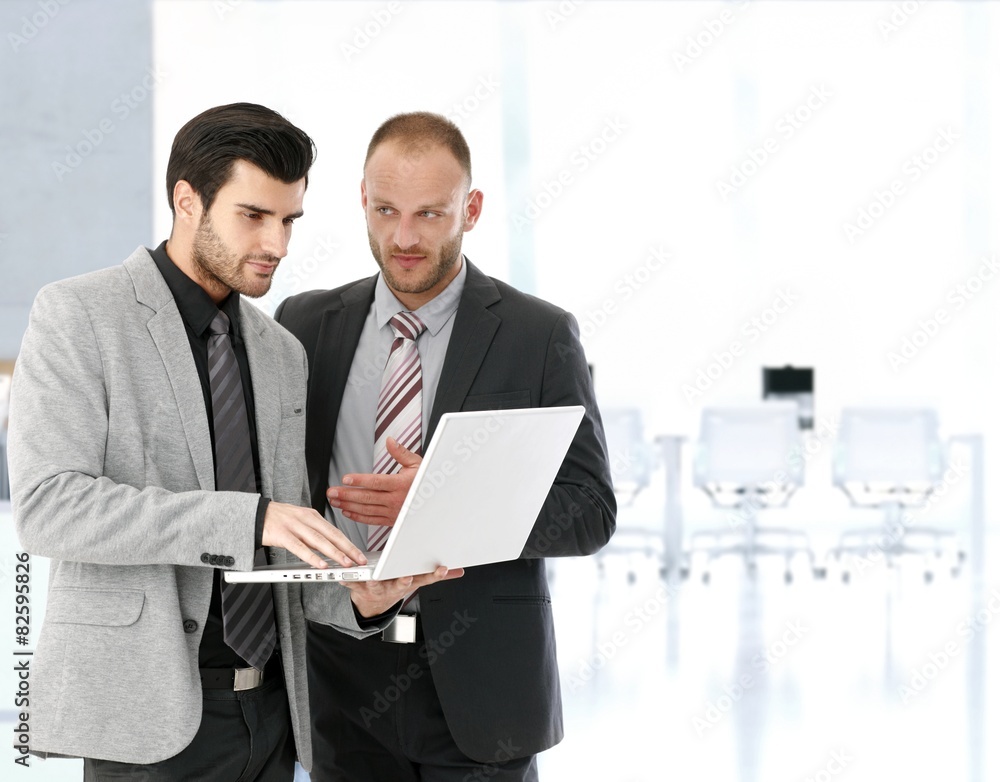 Businessmen working with laptop in meeting room Businessmen working with laptop in meeting room