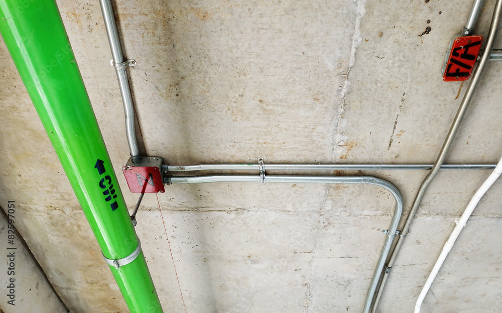 Green water pipes installed on the cement ceiling Green water pipes installed on the cement ceiling
