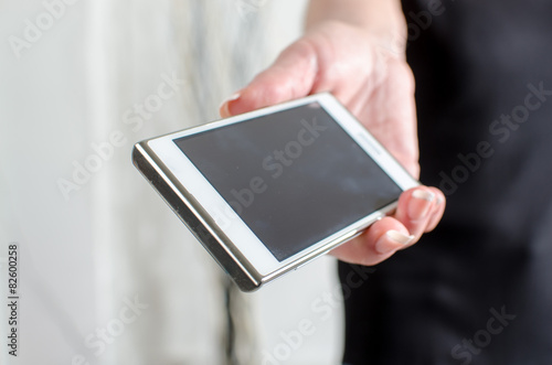 Woman hand holding a smartphone