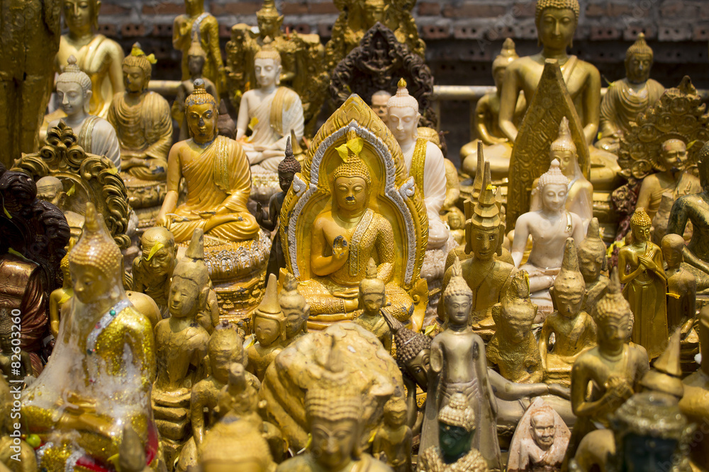 Fototapeta premium Group of Buddha image in public temple on Songkran Festival