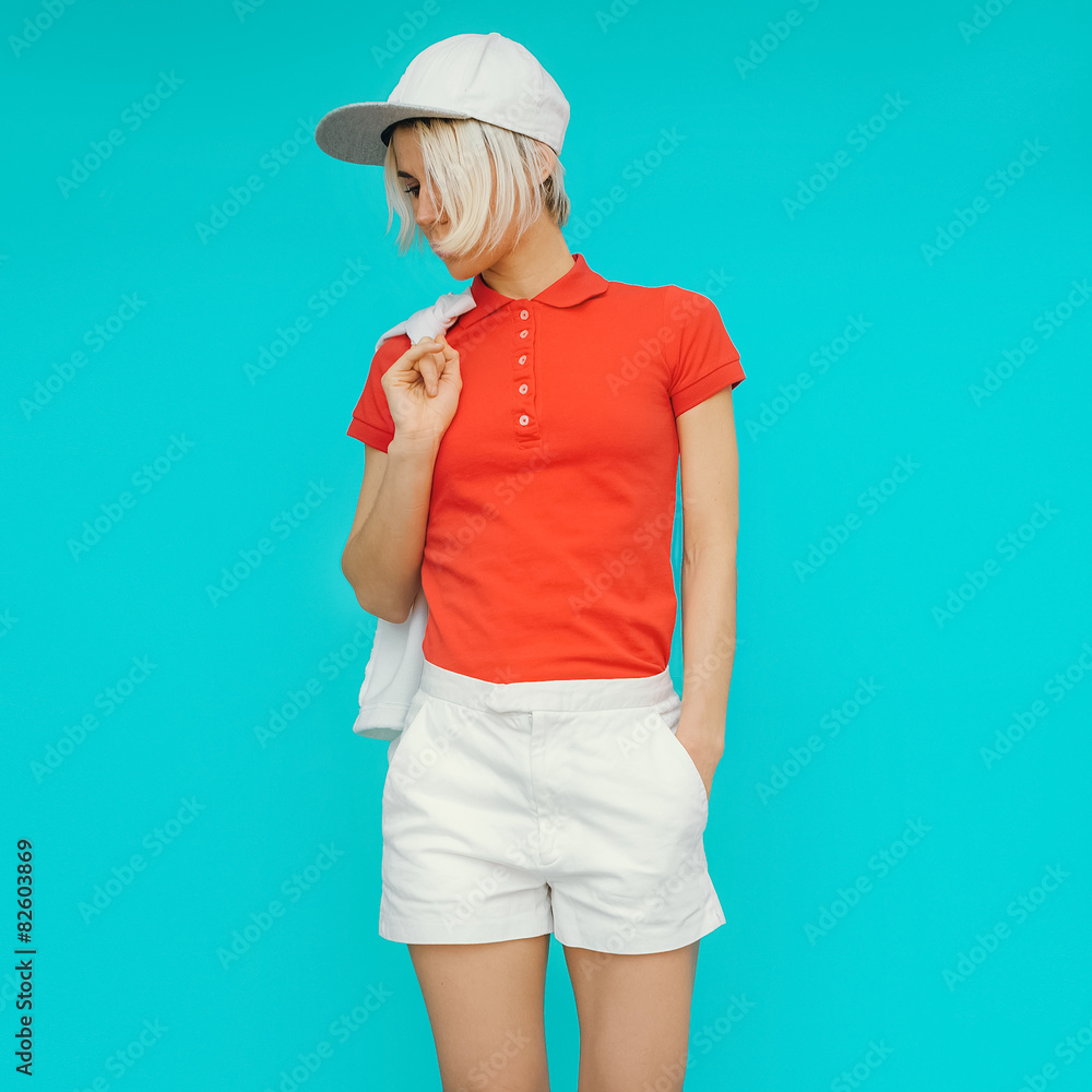 Sporty style. Girl in fashionable clothes and accessories Sporty style. Girl in fashionable clothes and accessories