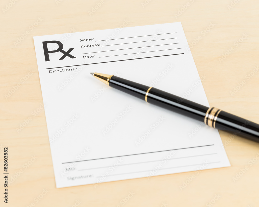 Blank prescription and pen, document is mock-up Blank prescription and pen, document is mock-up