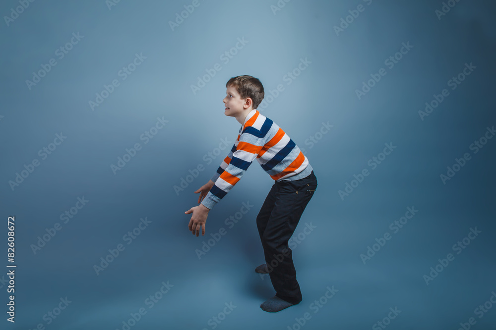 teenager boy standing European appearance on the floor stretched teenager boy standing European appearance on the floor stretched