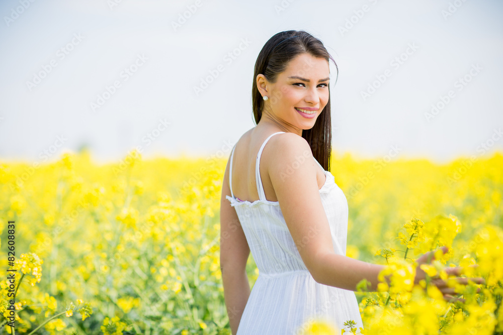 Young woman in the spring field Young woman in the spring field