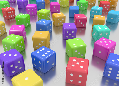 Tens of  dice arranged in random position and random colors
