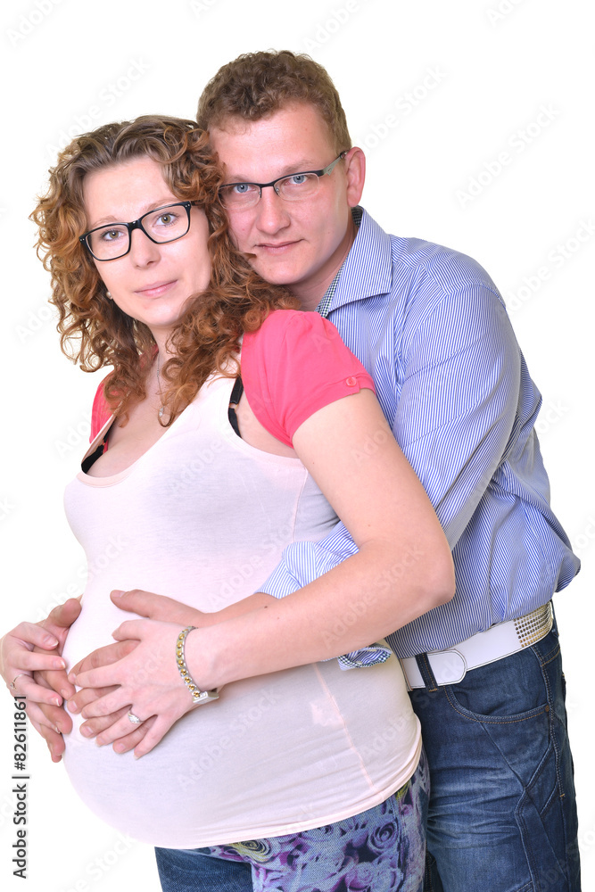 Young attractive couple: pregnant mother and happy father Young attractive couple: pregnant mother and happy father