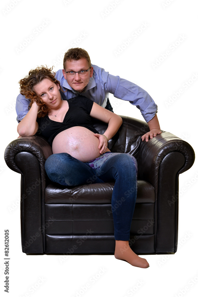 Young attractive couple: pregnant mother and happy father