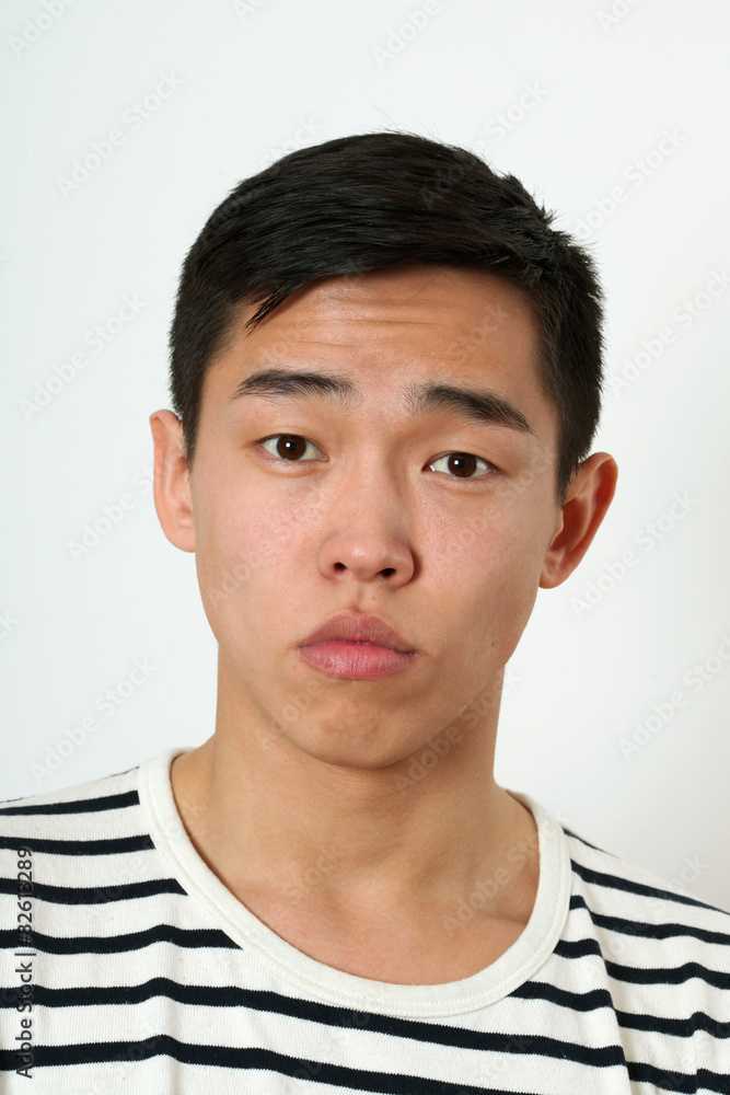 Obraz premium Romantic young Asian man looking at camera