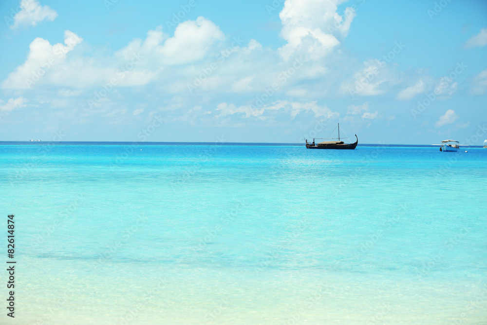 View of beautiful blue ocean water with ship in resort View of beautiful blue ocean water with ship in resort