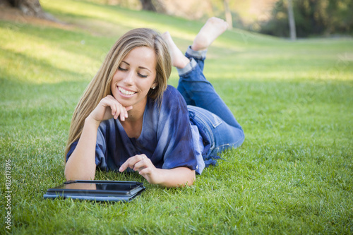 Smiling Young Woman Using C...